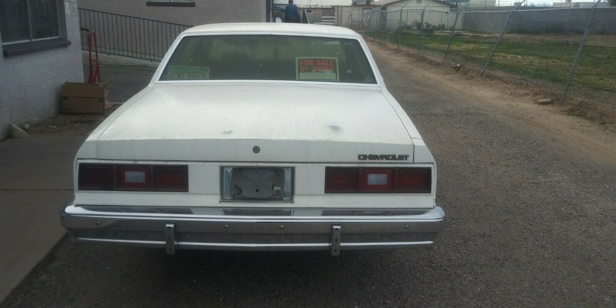 1985 White Chevrolet Impala Sedan