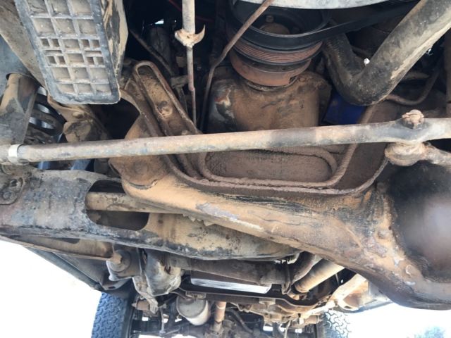 1985 blue and gray Ford Bronco 2door suv