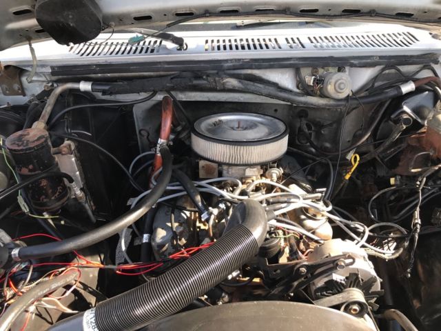 1985 blue and gray Ford Bronco 2door suv