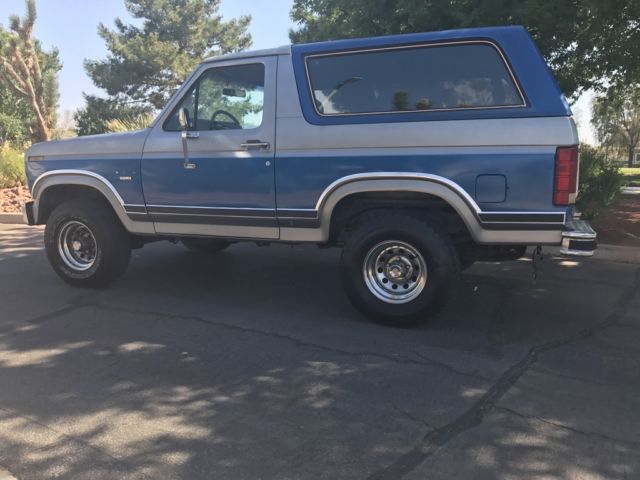 1985 blue and gray Ford Bronco 2 door bronco
