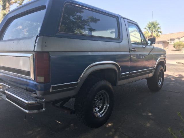 1985 blue and gray Ford Bronco 2 door bronco