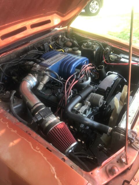 1985 Orange Ford Mustang Hatchback