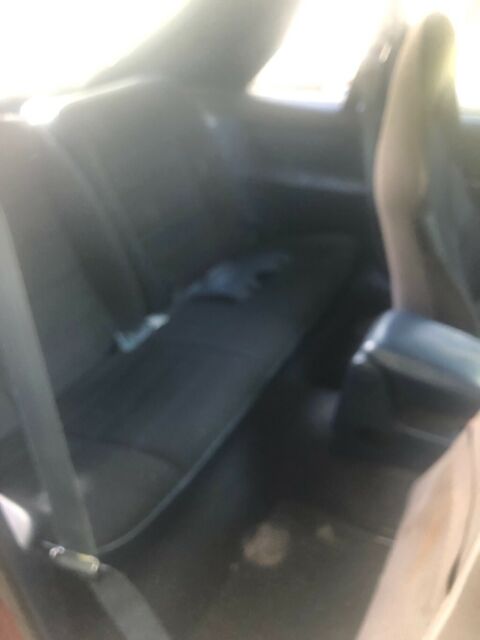 1985 Orange Ford Mustang Hatchback