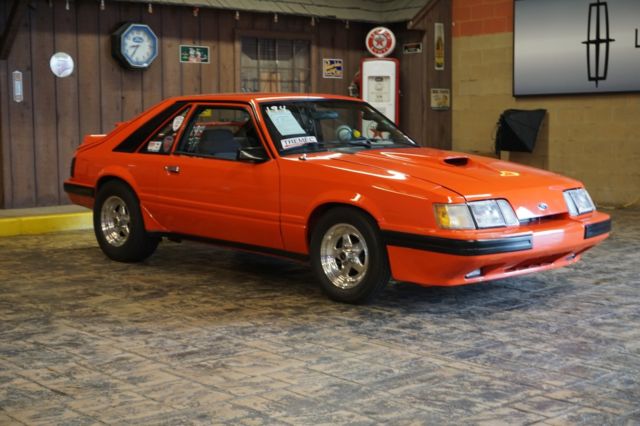 1985 Orange Ford Mustang Hatchback