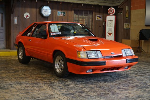 1985 Orange Ford Mustang Hatchback