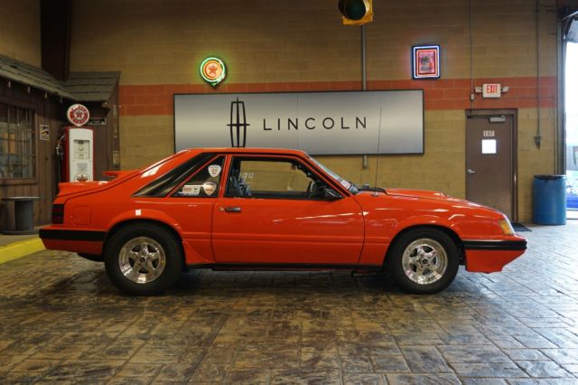 1985 Orange Ford Mustang Hatchback