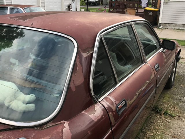 1985 Burgundy Jaguar XJ6 Sedan