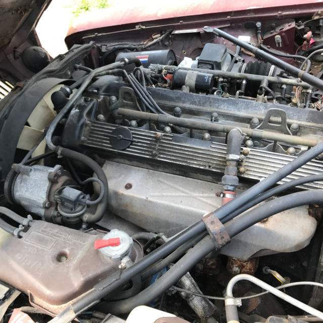 1985 Burgundy Jaguar XJ6 Sedan