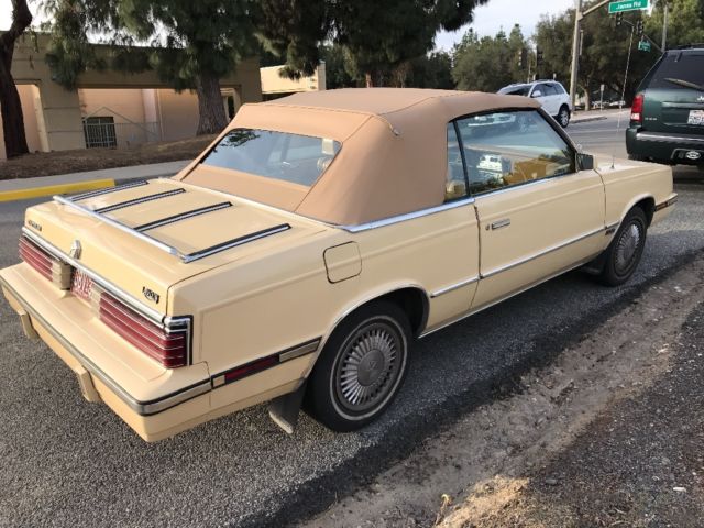 1985 Yellow Chrysler LeBaron Convertible