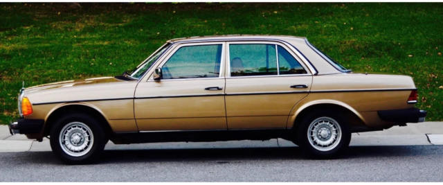 1985 Gold Mercedes-Benz 300-Series Sedan