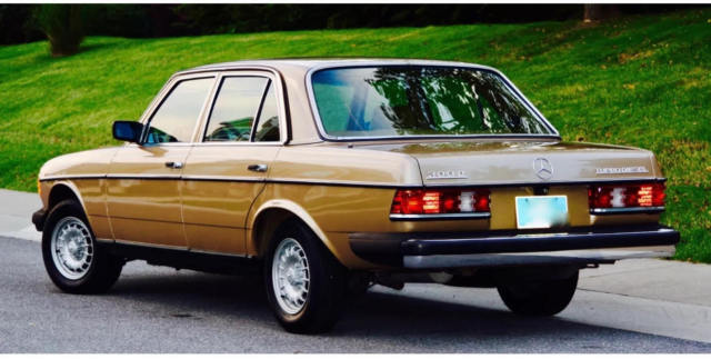 1985 Gold Mercedes-Benz 300-Series Sedan