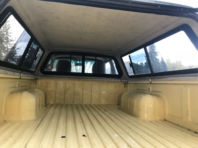 1985 yellow/custom stripe Nissan 720 Extended Cab Pickup