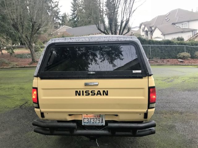 1985 yellow/custom stripe Nissan 720 Extended Cab Pickup