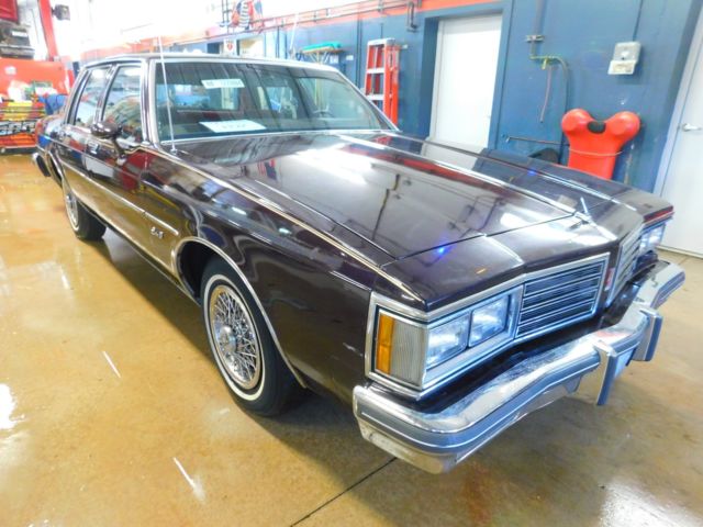 1985 Maroon Oldsmobile Eighty-Eight Sedan
