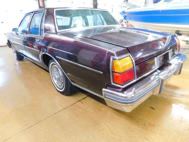 1985 Maroon Oldsmobile Eighty-Eight Sedan