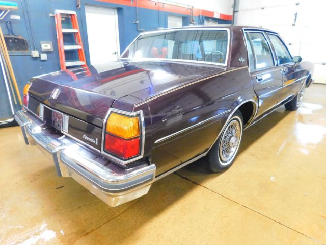 1985 Maroon Oldsmobile Eighty-Eight Sedan