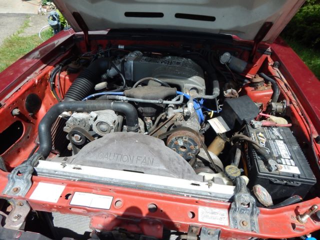 1986 deep red Ford Mustang Convertible
