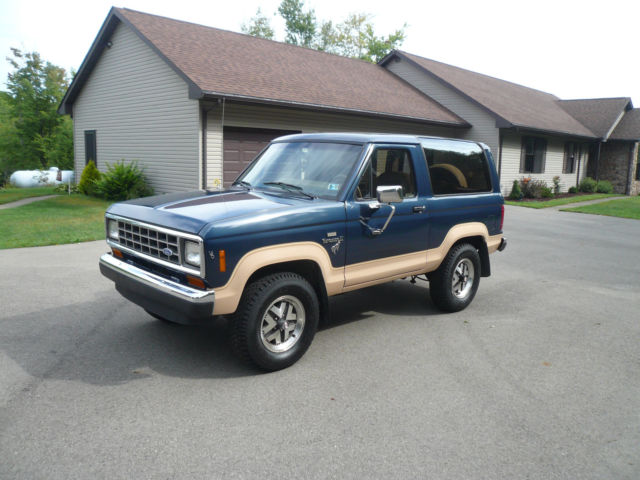 1986 Blue and Tan Ford Bronco II SUV