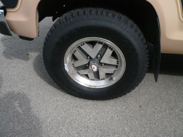 1986 Blue and Tan Ford Bronco II SUV
