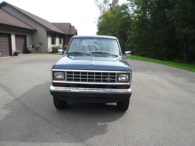 1986 Blue and Tan Ford Bronco II SUV