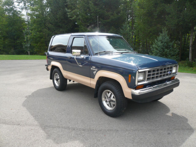 1986 Blue and Tan Ford Bronco II SUV