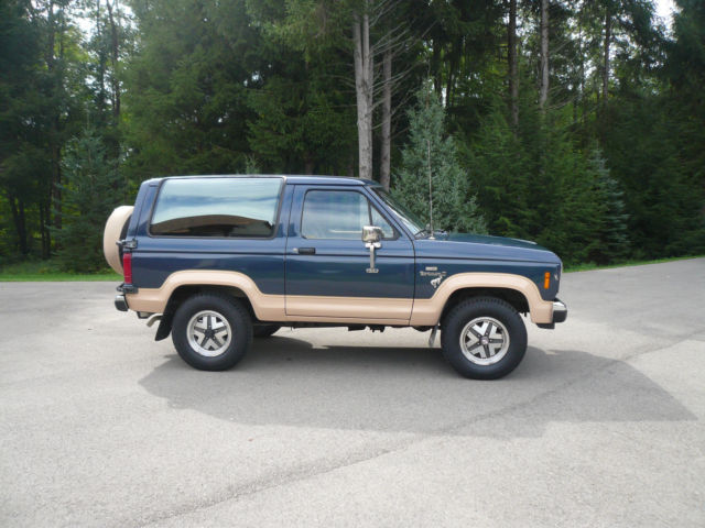 1986 Blue and Tan Ford Bronco II SUV
