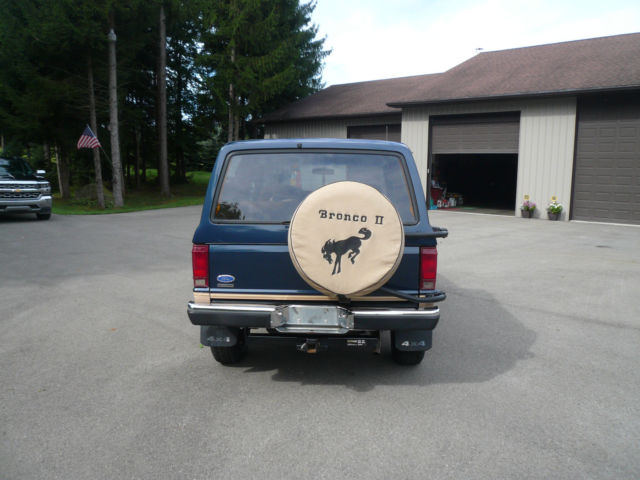 1986 Blue and Tan Ford Bronco II SUV