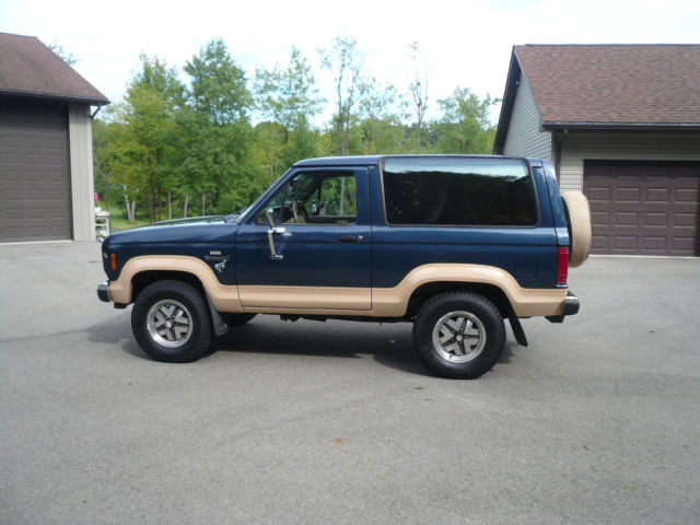 1986 Blue and Tan Ford Bronco II SUV