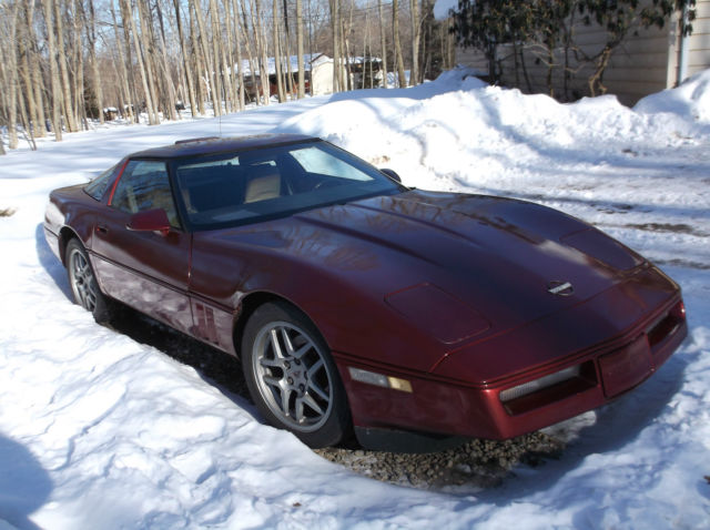 1986 maroon Chevrolet Corvette cp