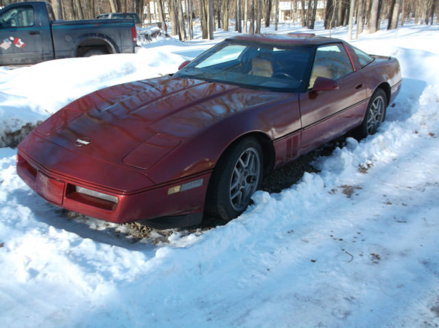 1986 maroon Chevrolet Corvette cp