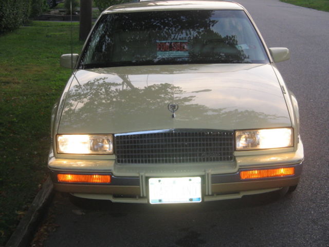 1986 cream Cadillac Eldorado Coupe