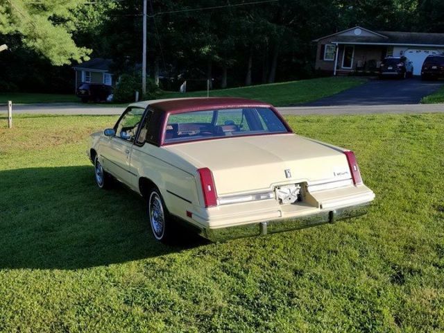 1986 Yellow Oldsmobile Cutlass Coupe