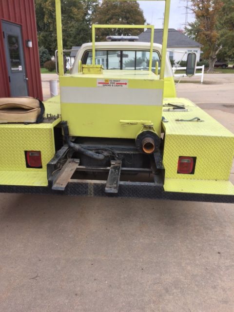 1986 Yellow and White Dodge Ram 3500 Cab and attached water tank on back