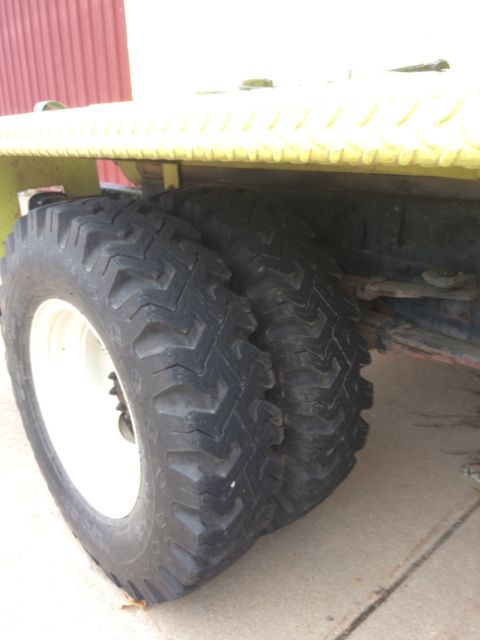 1986 Yellow and White Dodge Ram 3500 Cab and attached water tank on back