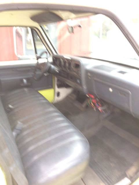 1986 Yellow and White Dodge Ram 3500 Cab and attached water tank on back
