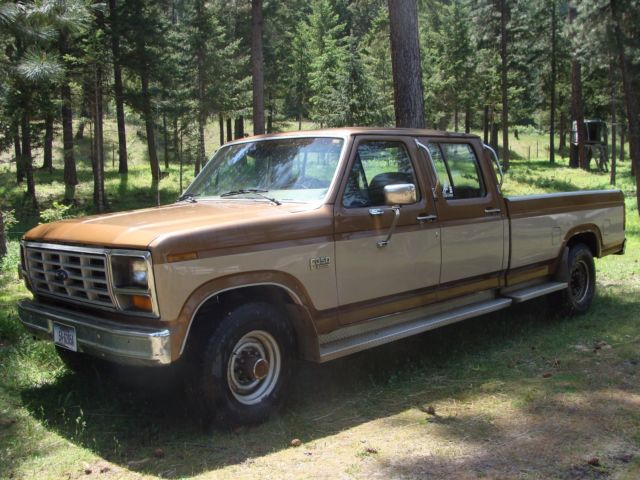 1986 tan and brown Ford F-350 Extended Crew Cab Pickup