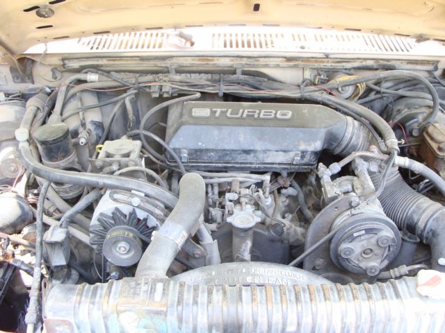 1986 tan and brown Ford F-350 Extended Crew Cab Pickup