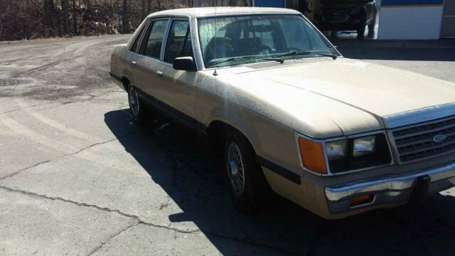 1986 Burgundy Ford LTD Sedan