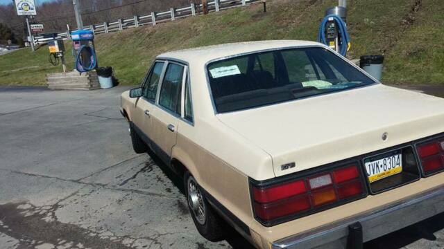 1986 Burgundy Ford LTD Sedan