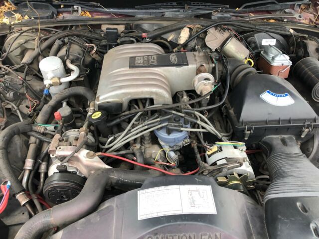 1986 Burgundy Ford Crown Victoria