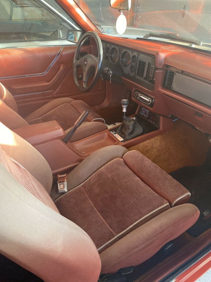 1986 Red Ford Mustang Sedan