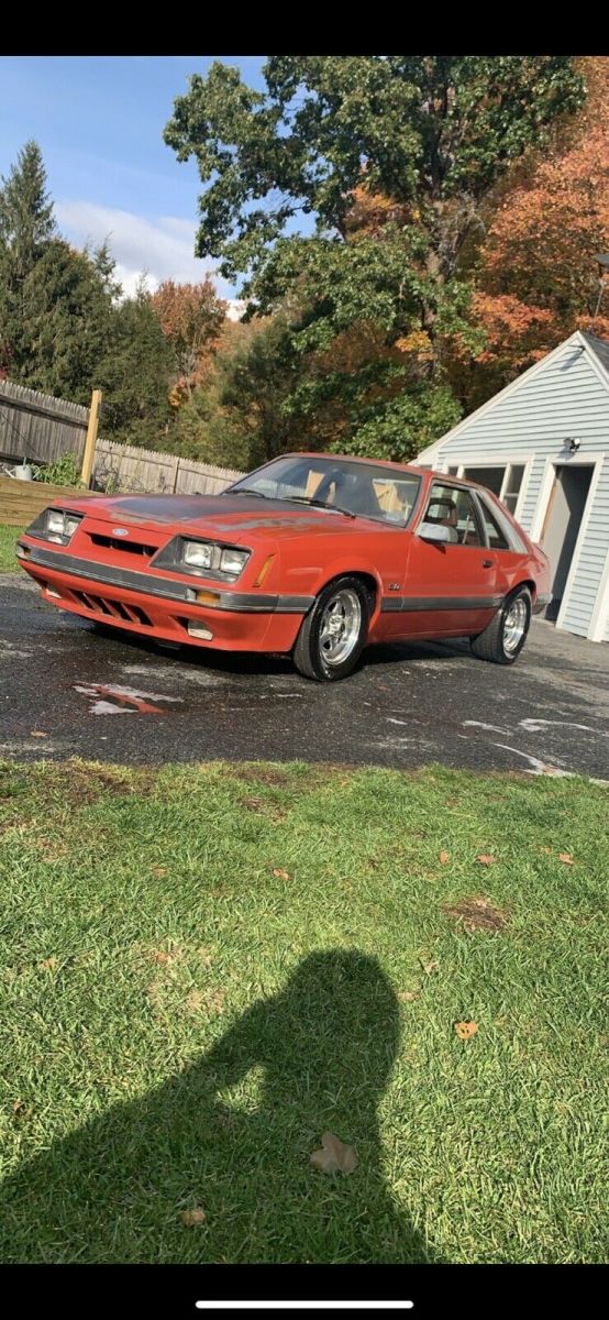 1986 Red Ford Mustang Sedan
