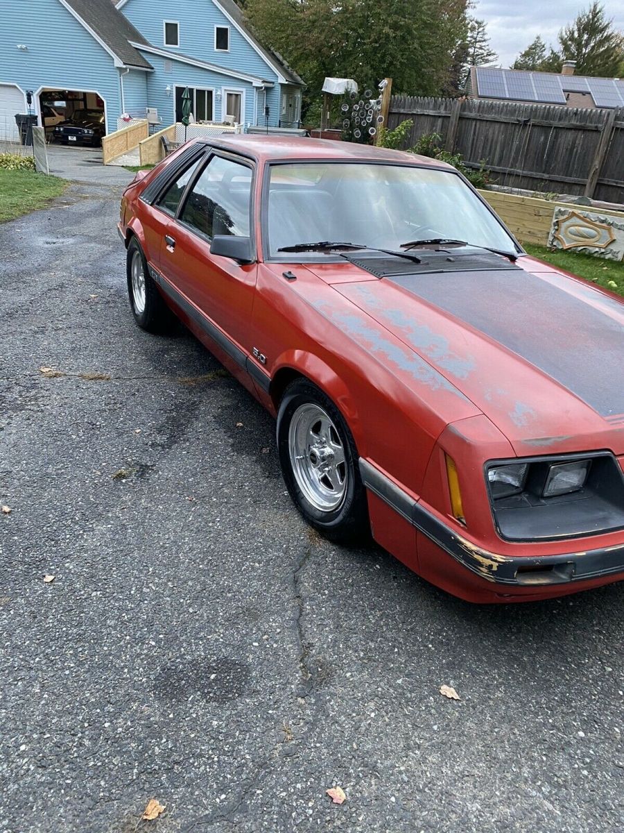 1986 Red Ford Mustang Sedan