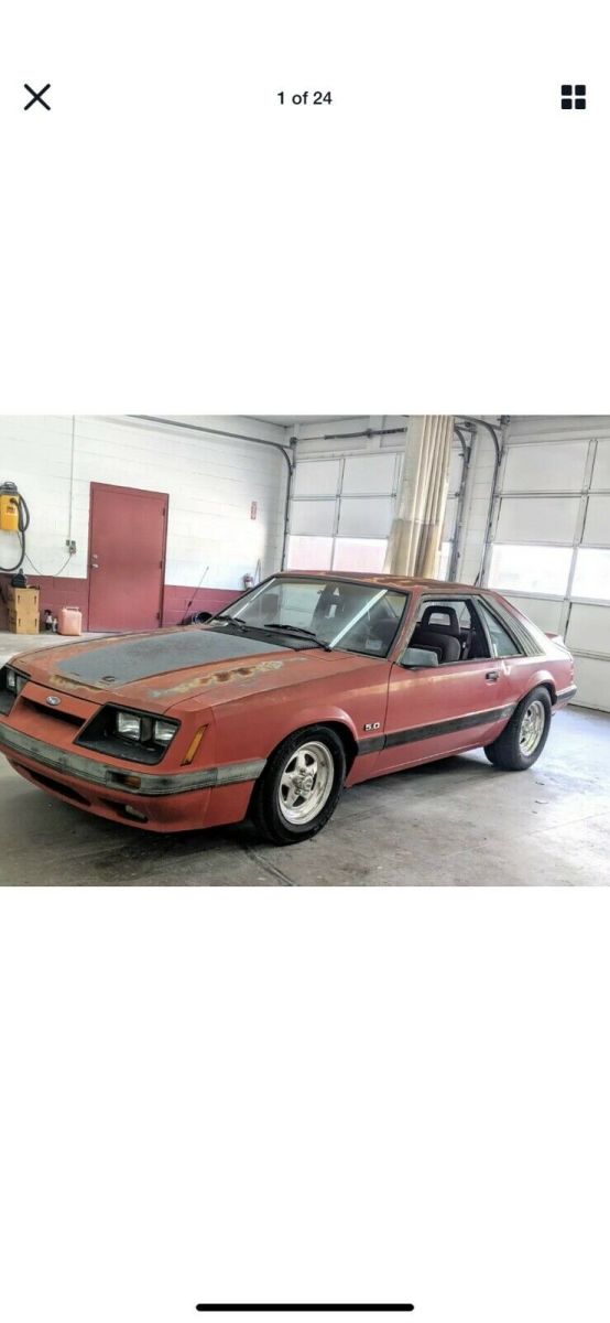 1986 Red Ford Mustang Sedan