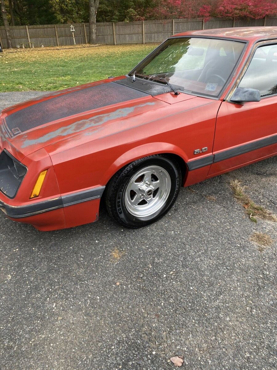 1986 Red Ford Mustang Sedan