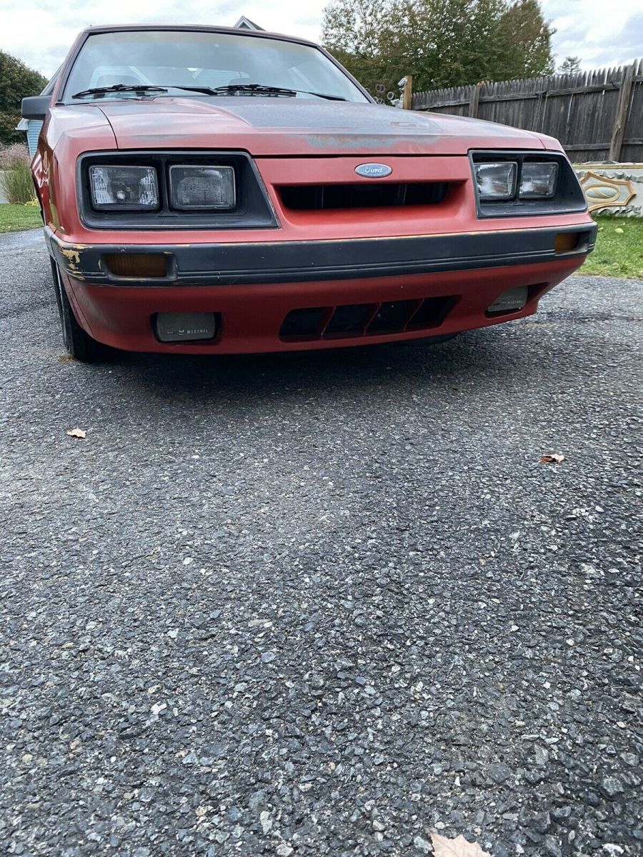1986 Red Ford Mustang Sedan