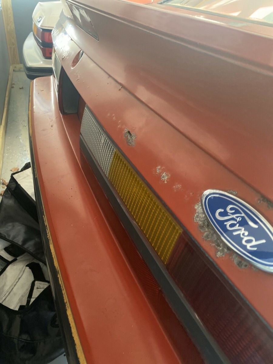 1986 Red Ford Mustang Sedan