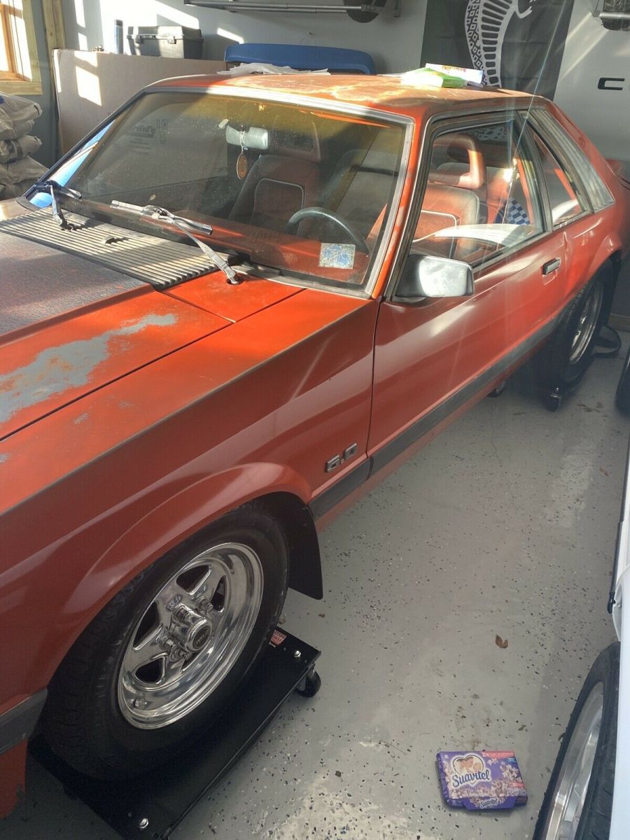 1986 Red Ford Mustang Sedan