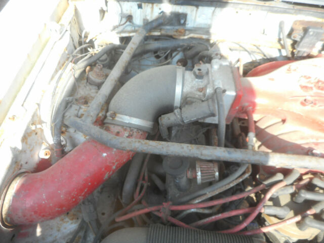 1986 white Ford Mustang Convertible