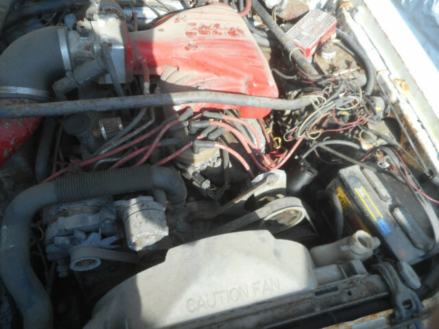 1986 white Ford Mustang Convertible